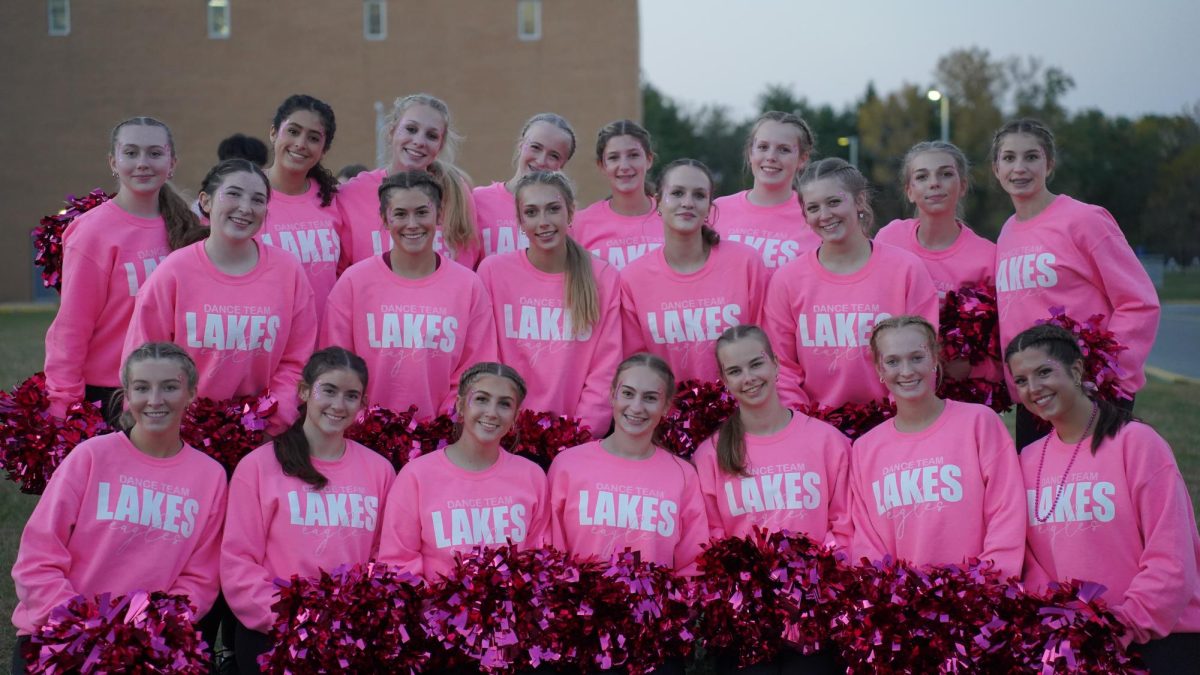 Dance team outside Lakes High School for Pink Out Game 