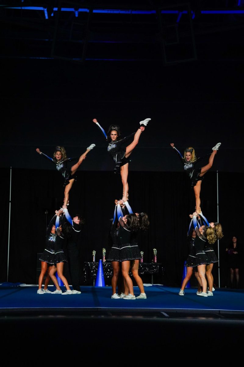 The cheer team soars to success during the annual "All of the Lights" competition. 